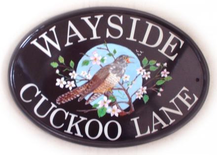 Cuckoo in blossom branch - Painted on a New World Classic Oval base plaque with Century Schoolbook font. Painted by Jean from her own design.