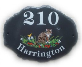 Brown and black tabby cat in a strawberry patch - painted by Jean on a large natural oval