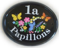 Papillons  sign - painted on a large classic oval house sign by Jean. Font is called Tiffany