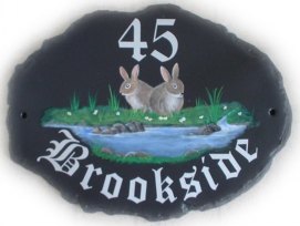 Rabbits by a brook - painted by Gerry, font is called Old English text